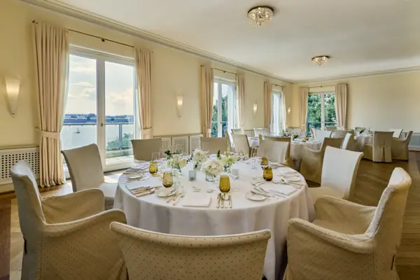 Louis C. Jacob’s Landscape Room A room with a view at the Hotel Louis C. Jacob, featuring decorated round tables.