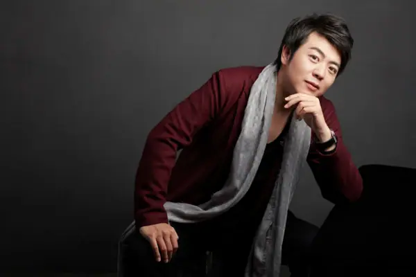 Lang Lang A man in a red jacket and a grey scarf.