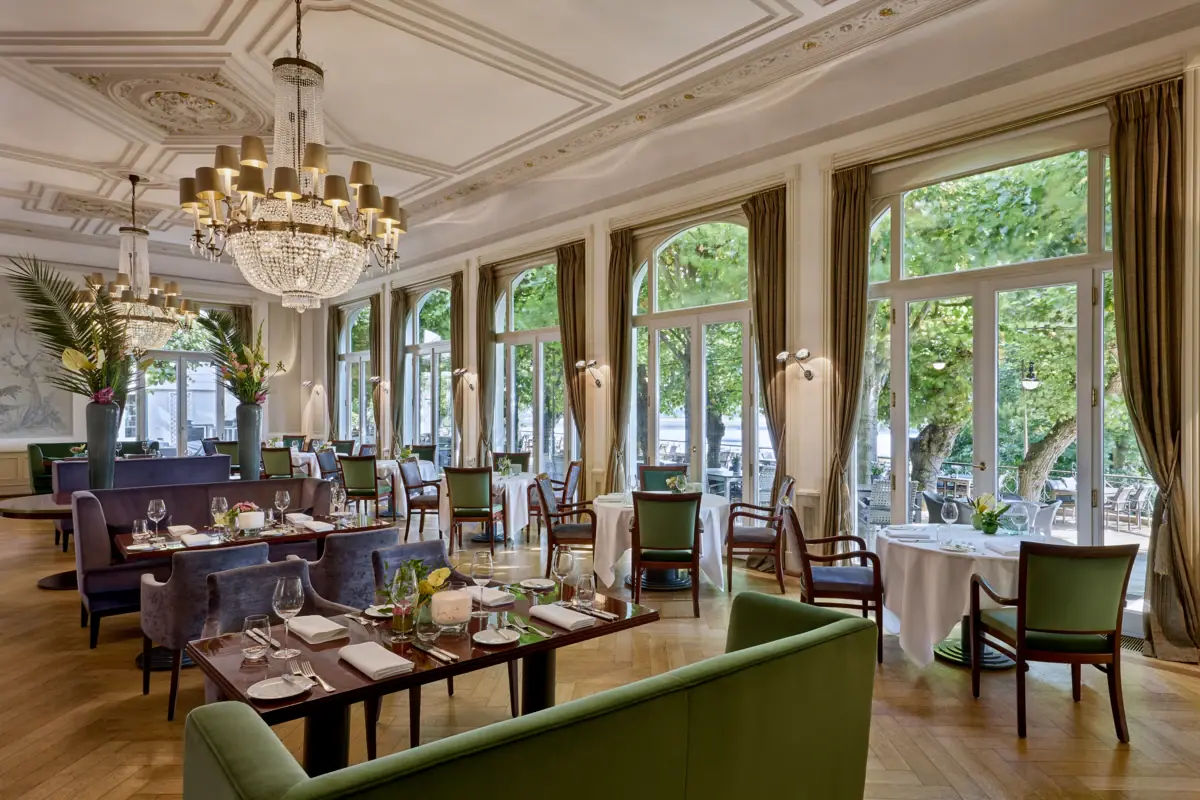 Jacobs Restaurant A restaurant with laid tables and chandeliers.