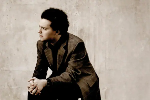 Evgeny Kissin Evgeny Kissin, wearing a suit, is deep in thought.