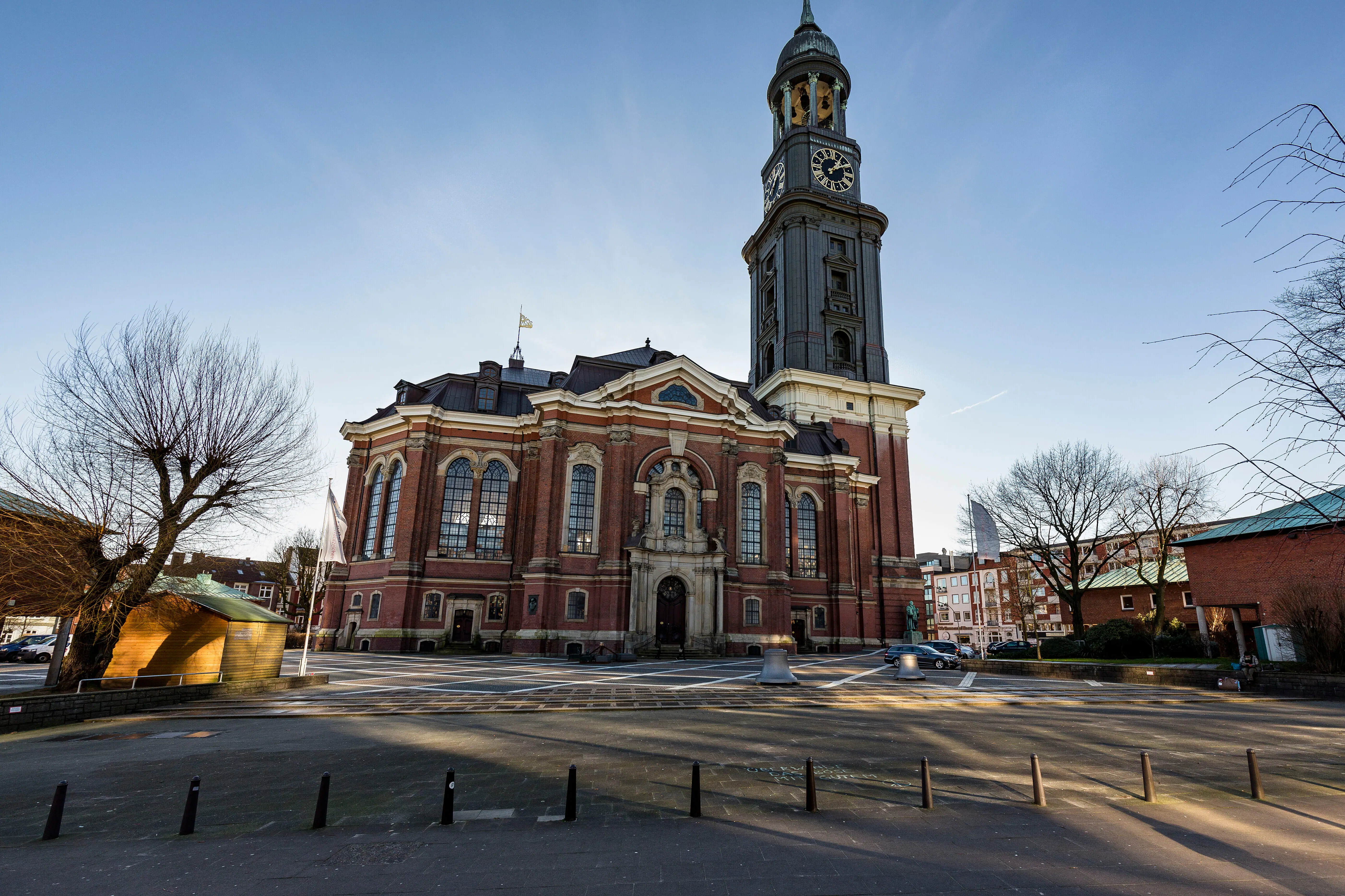 St. Michael's Church A large brick building with a clock tower under a clear sky.