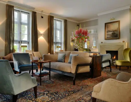 A cozy living room with a fireplace and comfortable couches.