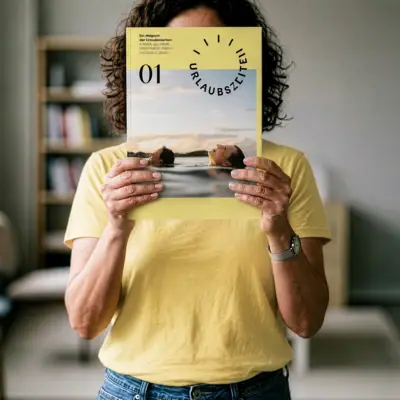 Holiday periods A woman is holding the *Urlaubszeiten* magazine up to her face.